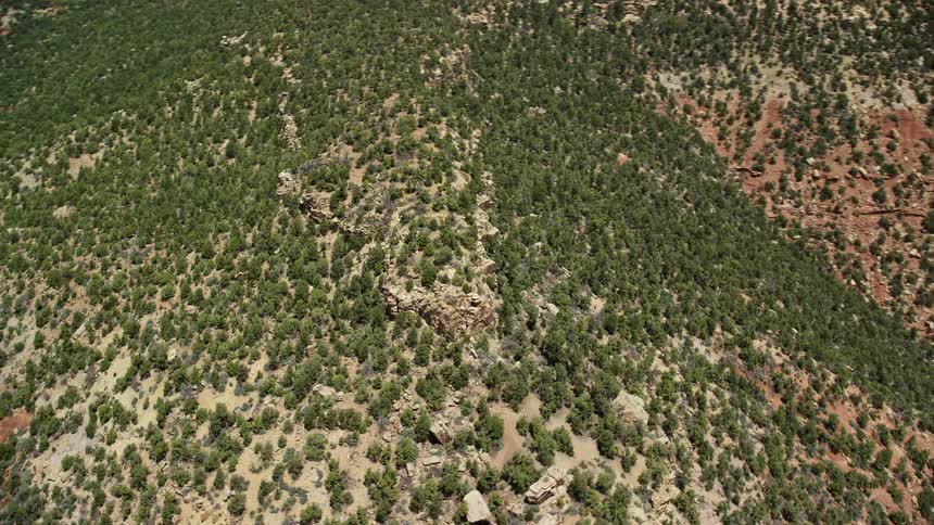  aerial footage showcasing the stunning landscape of Manti-La Sal National Forest in Utah as the camera orbits the top of a mesa on a sunny day revealing the arid beauty of the desert and table mountains