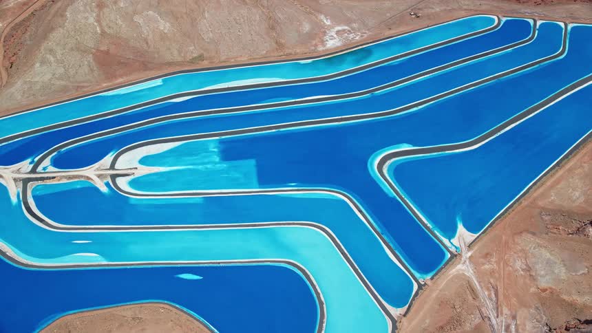  aerial footage of multiple potash ponds in a desert valley Moab Utah captured from a bird's eye perspective