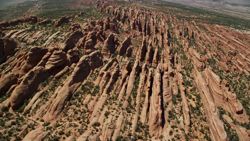 an aerial view of red rock canyon walls in Devil's Garden Arches National Park Utah during a sunny day in summer