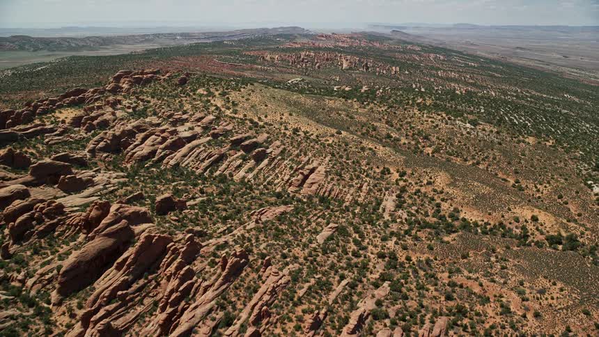 Aerial footage of rock fins in Devil's Garden Arches National Park Utah during a sunny day in summer