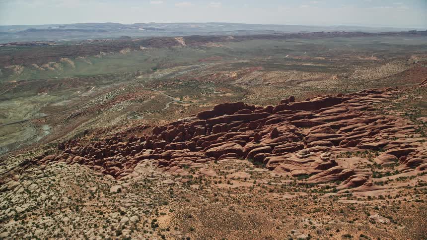  aerial footage showcasing the stunning rock fins and formations of the Fiery Furnace in Arches National Park Utah during a sunny day