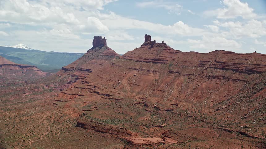  aerial footage of sunny desert buttes in Moab Utah during summer showcasing the arid and natural beauty of the southwest United States