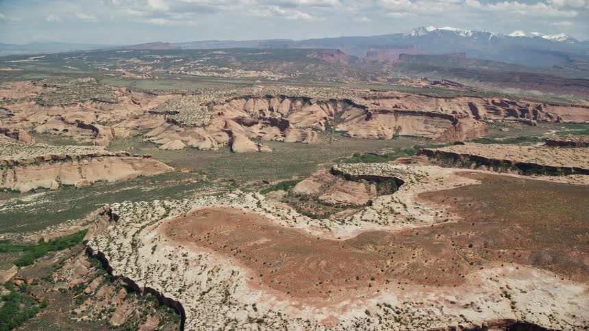 Aerial footage showcasing the breathtaking Salt Wash Canyons in Arches National Park Utah during a sunny day in the summer