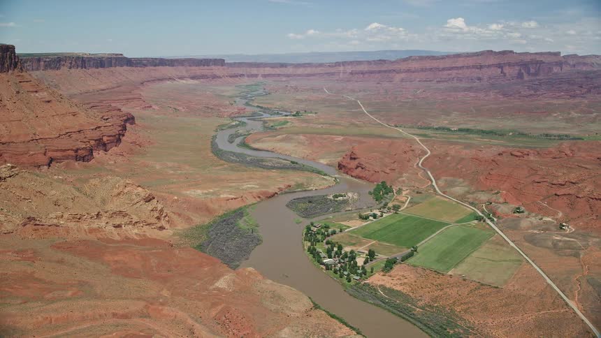 an aerial view of the Sorrel River Ranch Resort and Spa by the Colorado River in Moab Utah showcasing the natural beauty of the Southwest United States during summertime