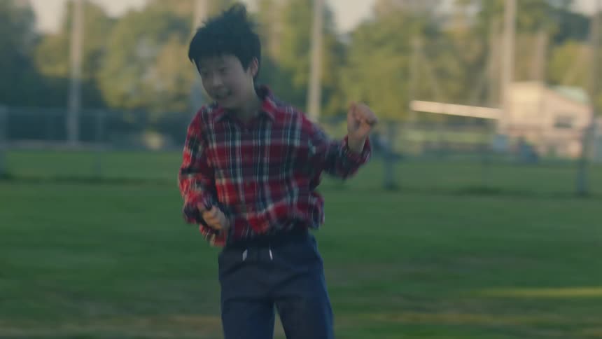 Boy running in a park