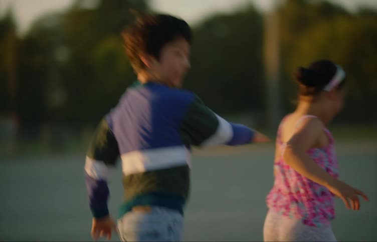 A group of children playing in a sports field