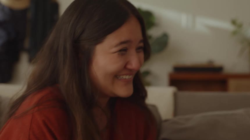 Two women talk laugh and cry