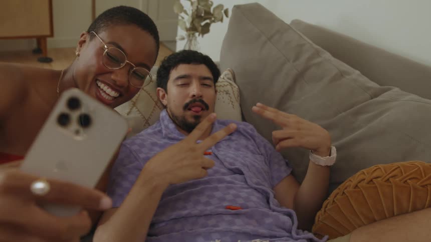 Friends are having fun taking selfies on a cellphone