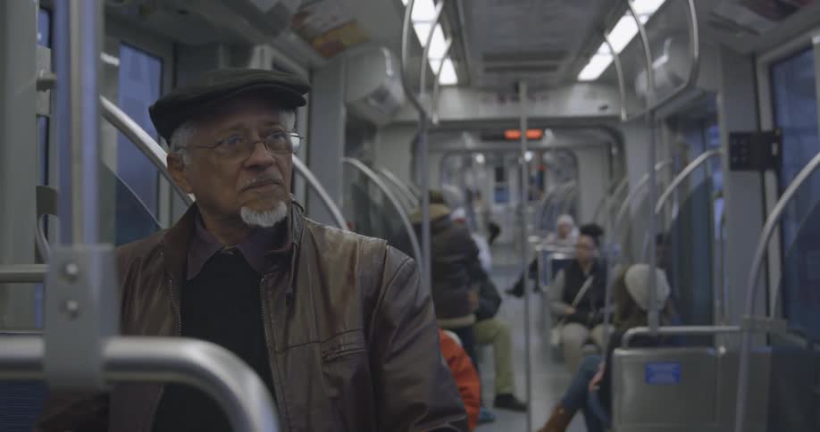 Man rides the bus alone at night