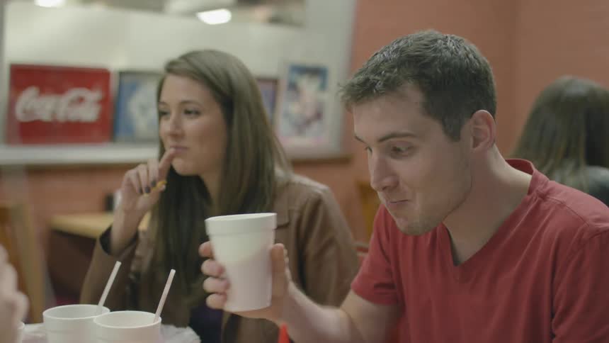 People talking while eating their lunch in a fast food place