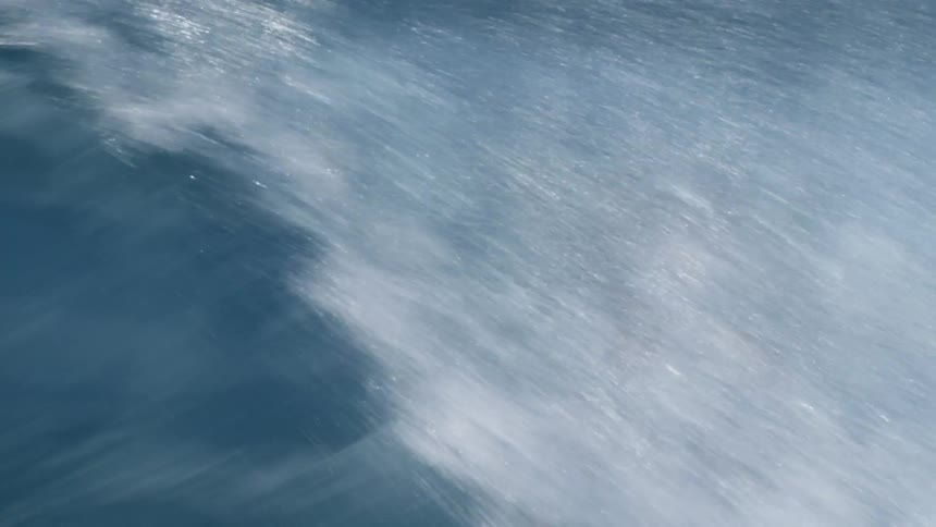 Man wearing shorts surfing outdoors on the sea during day time