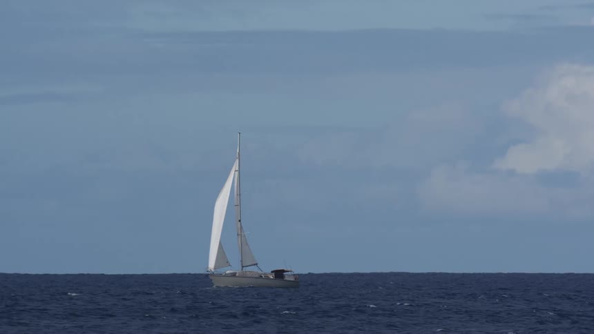 Small sailboat in motion on the ocean