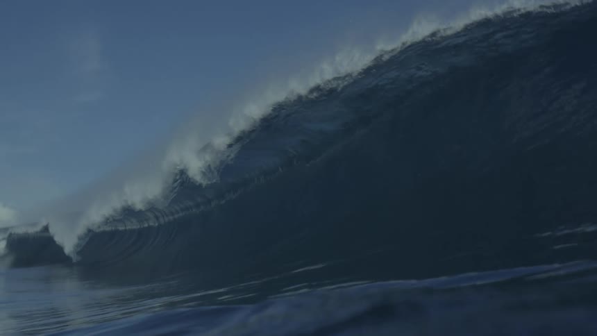 A giant wave crashing into the sea