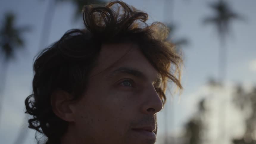Face of a young man at morning on a tropical area
