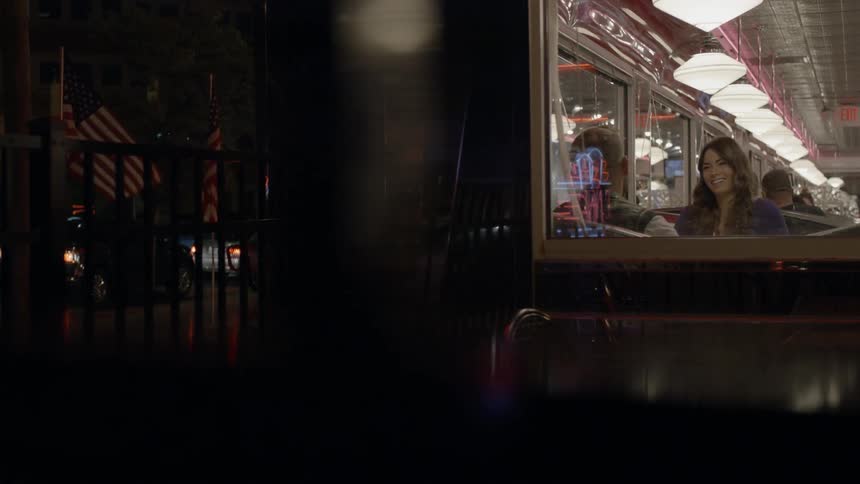 People are inside a restaurant at night