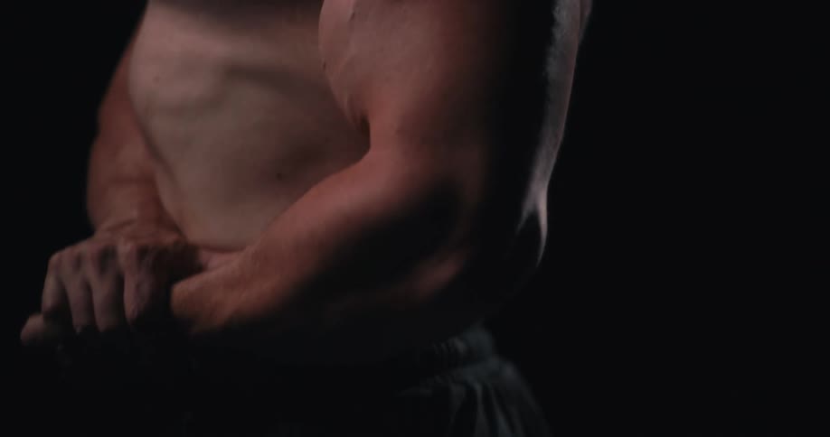 A man is flexing his muscles