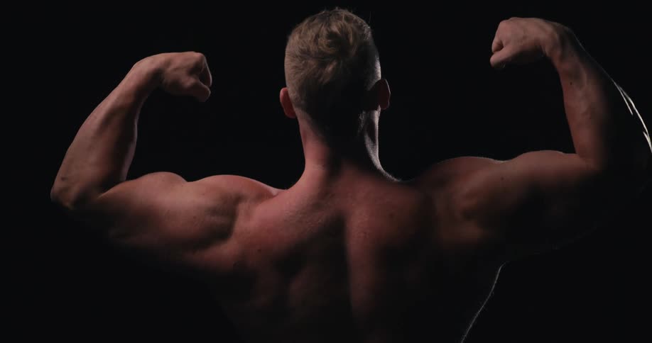 A man flexing his arm muscles