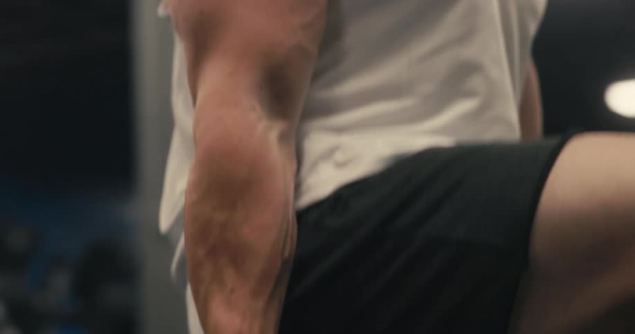 A man is lifting weights in the gym
