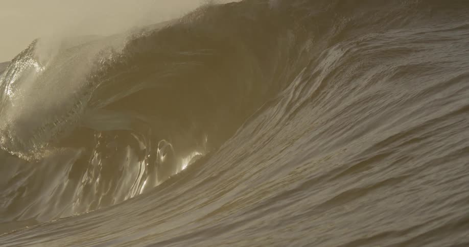 Water waves in the ocean at sunset