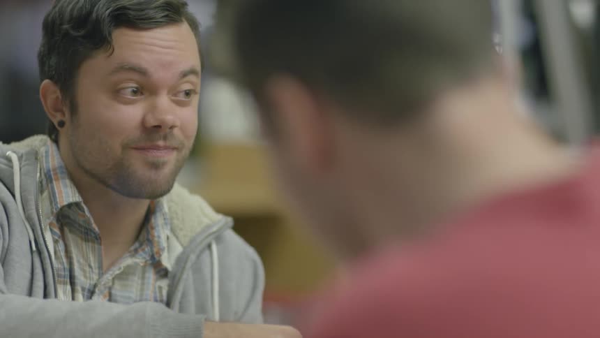 Group of men talking while eating their lunch