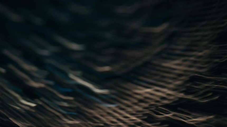 Abstract particles flashing by on a dark space