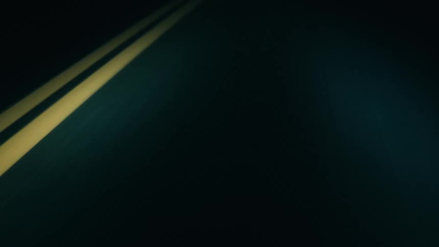 Asphalt of a desert road on a dark night