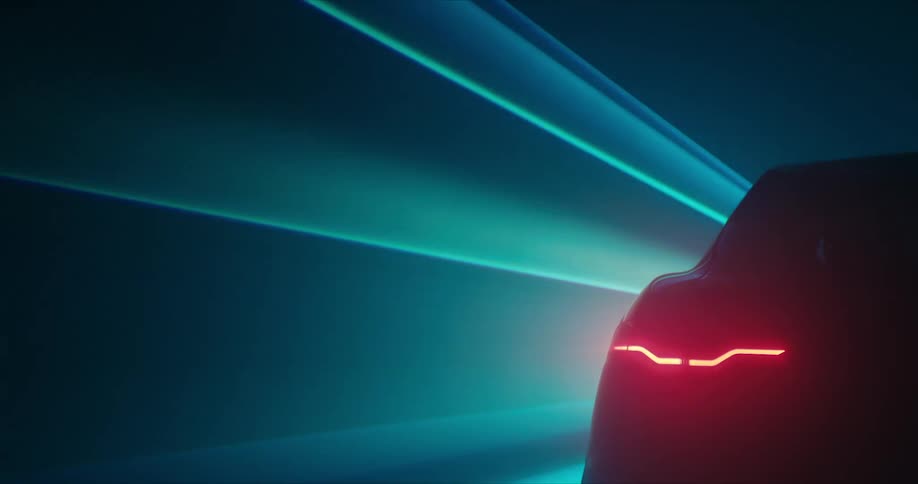 Blue rays of light shine past car with its taillight on