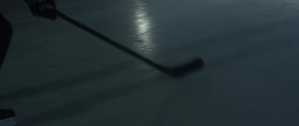 A person ice skating while stick handling