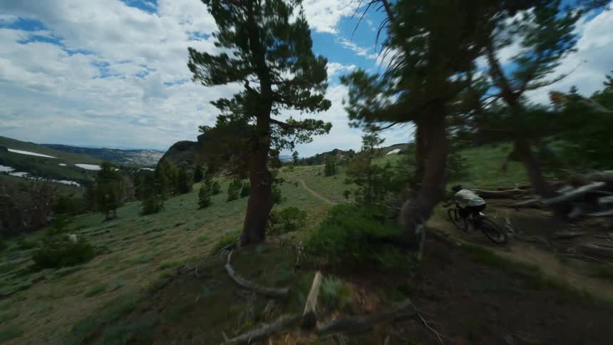 Man mountain biking at high speed