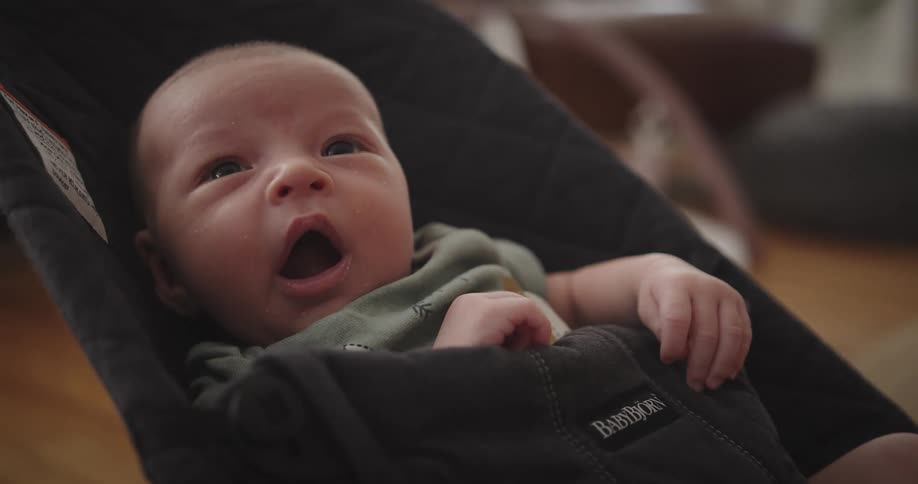 Portrait of a baby lying down and cooing