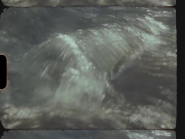 Swiftly moving water flows over several rocks located in this river