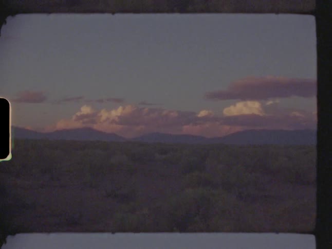 Flat landscape skyline with mountains on the horizon
