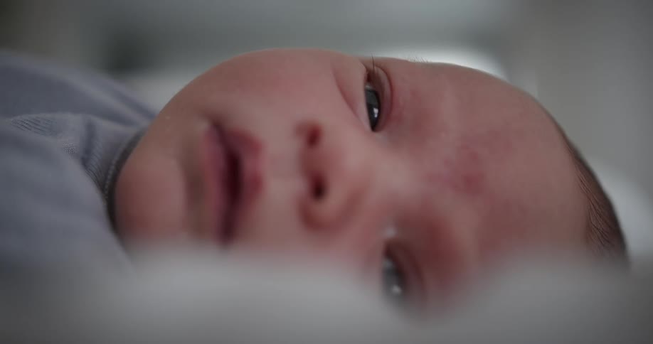 Portrait of a baby lying down with open eyes