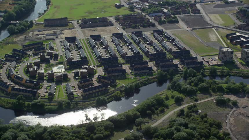 Aerial view of a river twisting around a neighborhood
