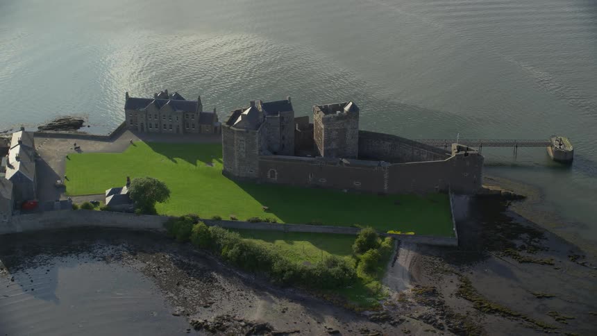 Aerial view of a small castlelike structure by the sea