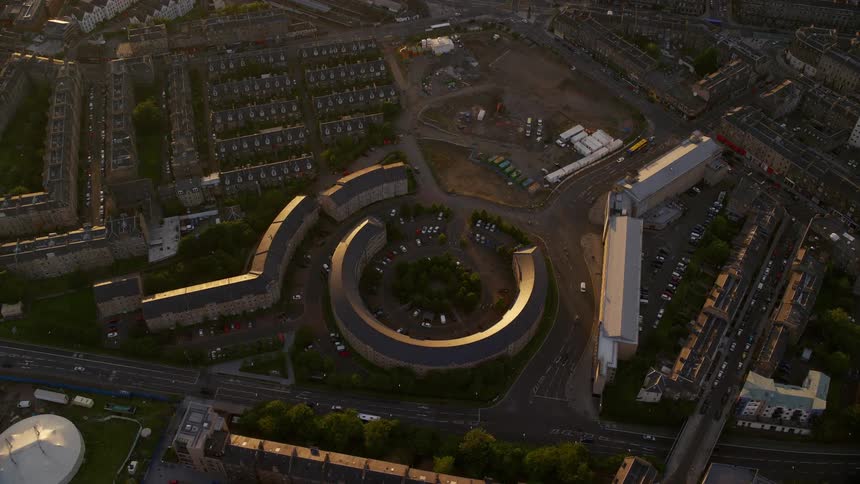 Aerial view of city rooftops at golden hour
