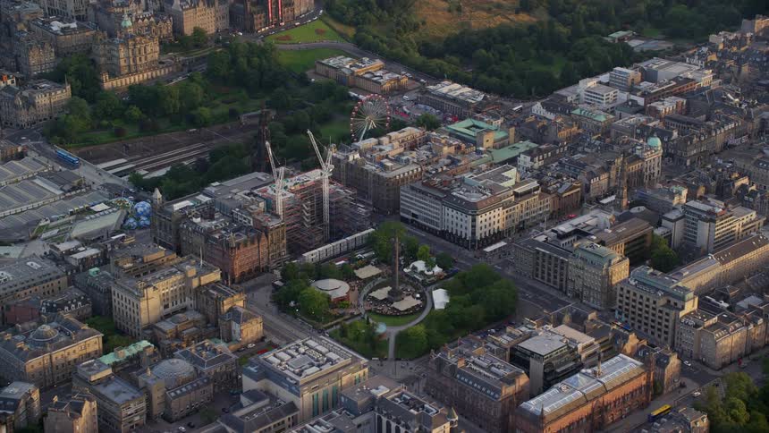 Aerial view of a park in the middle of the city at evening