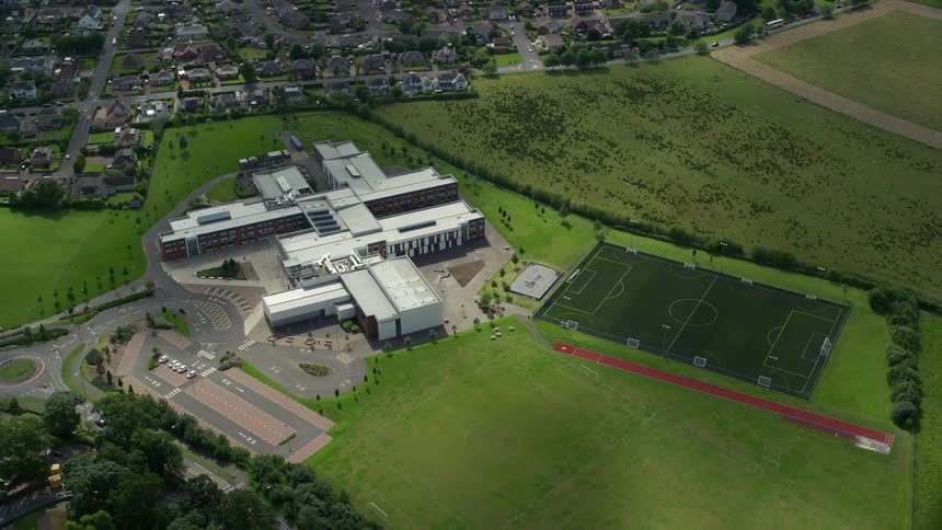 Aerial of a building complex in the middle of the suburbs