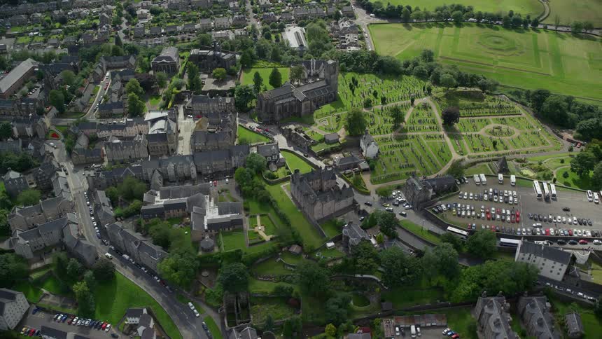 Aerial view of a cemetery and a church in a lush vegetationrich area