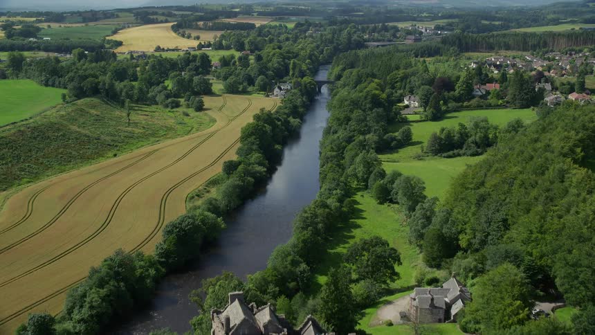 Aerial of a rural town with a castle and rivers