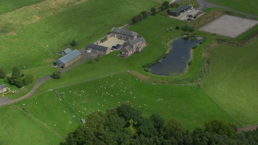 Aerial of the farmhouse during a sunny day