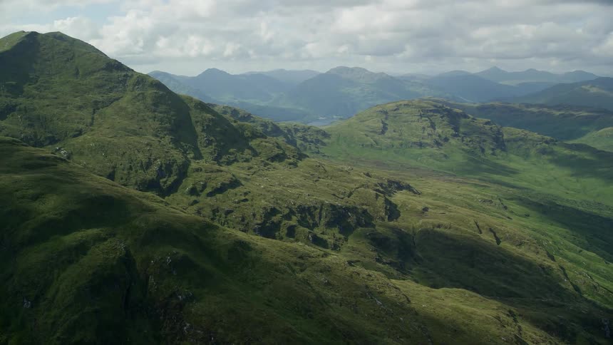 Aerial view of green vegetation on the slopes of a mountain range