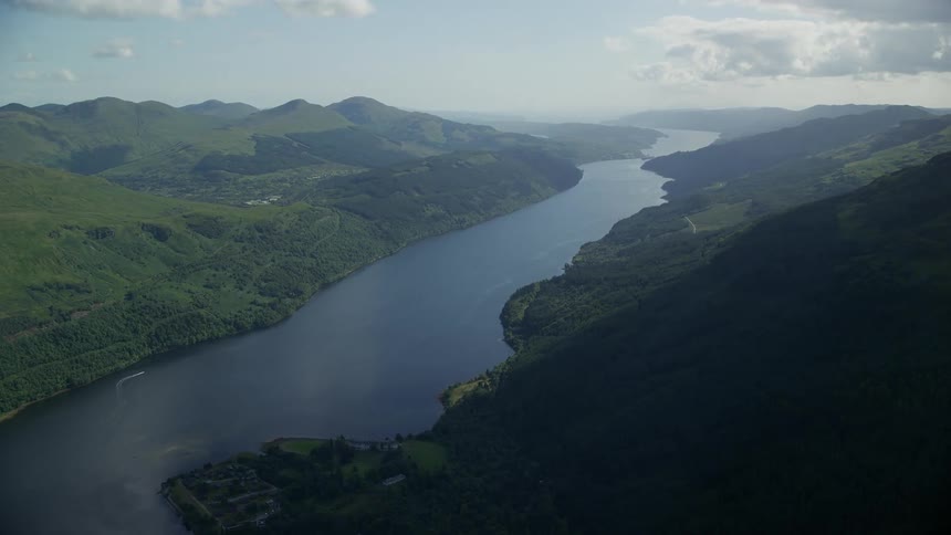 Aerial of the river and green mountains during the day