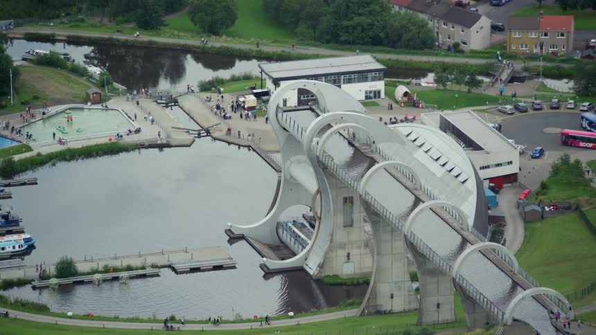 An artificial lagoon with structures and several people visiting the place