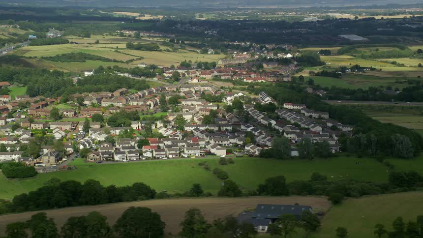 Rural city skyline with green plains