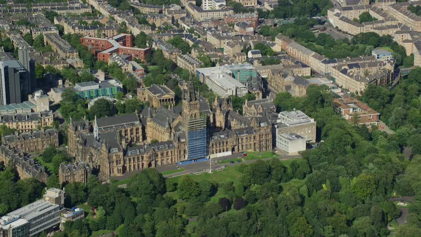 Aerial view of a castle in the middle of a town at daytime