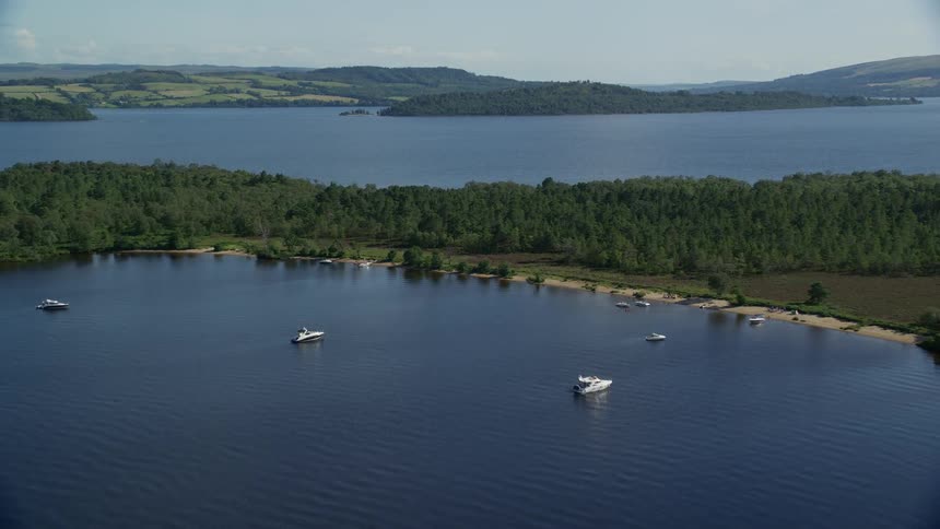 Aerial view of boats on the coast of an island in a lake