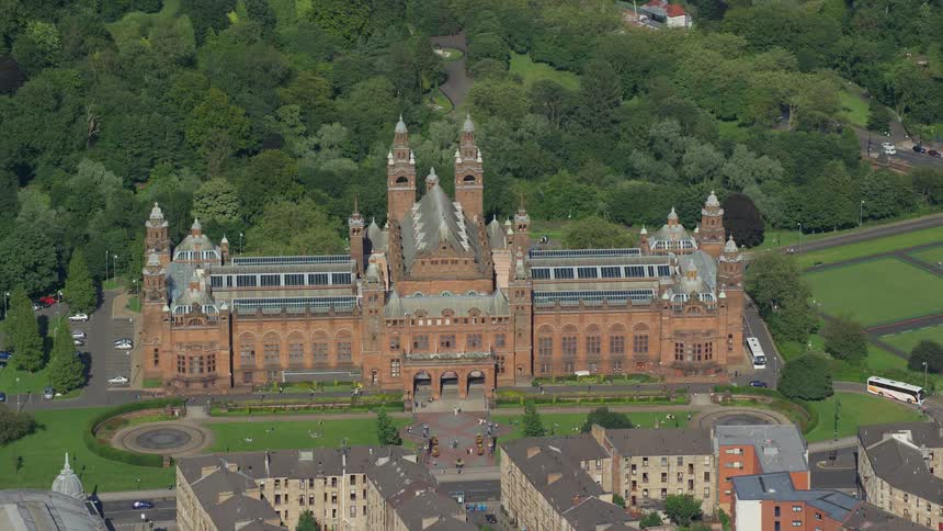 Aerial view of a castle next to a town in the countryside