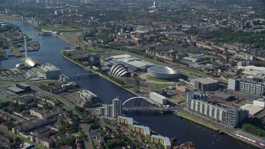 A river that passes through the middle of a city with buildings with modern architecture
