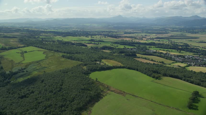 Aerial view of extensive farm fields in the plains at daytime